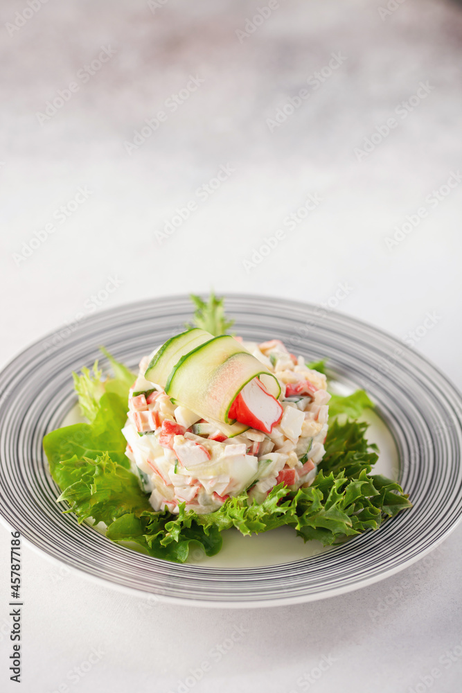 Salad of crab sticks, cucumbers, eggs and corn. Russian festive food Salad of crab sticks, cucumbers, eggs and corn. Russian festive food