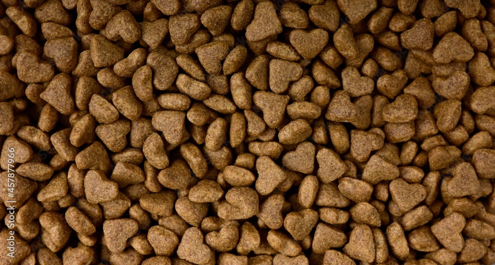 heart shaped, dryed pet food background texture. heart shaped, dryed pet food background texture.