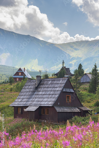 Beautiful views of the Polish High Tatras with mountain lakes and picturesque houses in the summer season
