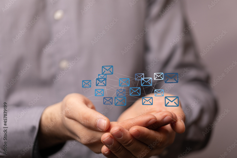 Hand holding using mobile phone with email icon on screen. Concept of business communication Hand holding using mobile phone with email icon on screen. Concept of business communication