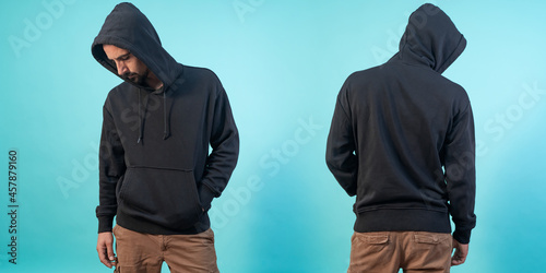 Front and back view of a black hoodie mockup for design print on blue background. photo