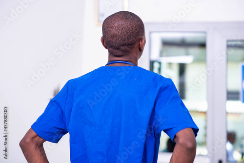rear view of young male doctor in hospital.
