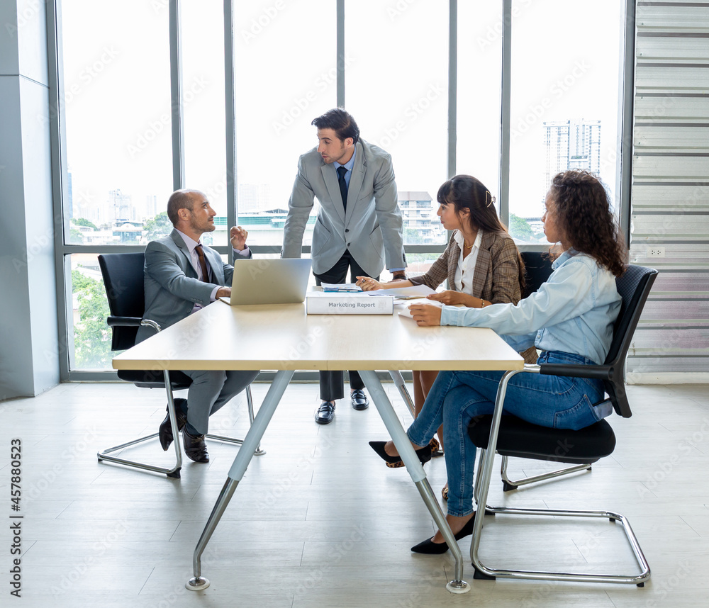 Businesspeople discussing together in the conference room during meeting at the office.