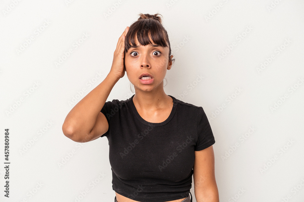 Young mixed race woman isolated on white background being shocked, she has remembered important meeting. Young mixed race woman isolated on white background being shocked, she has remembered important meeting.