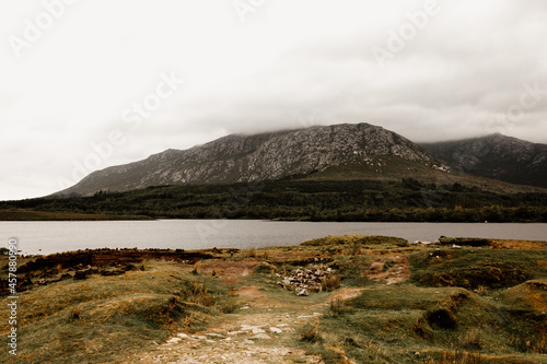 Hill side and lake in Connemara Ireland. A grassy slope in an overcast day, no rain. 
