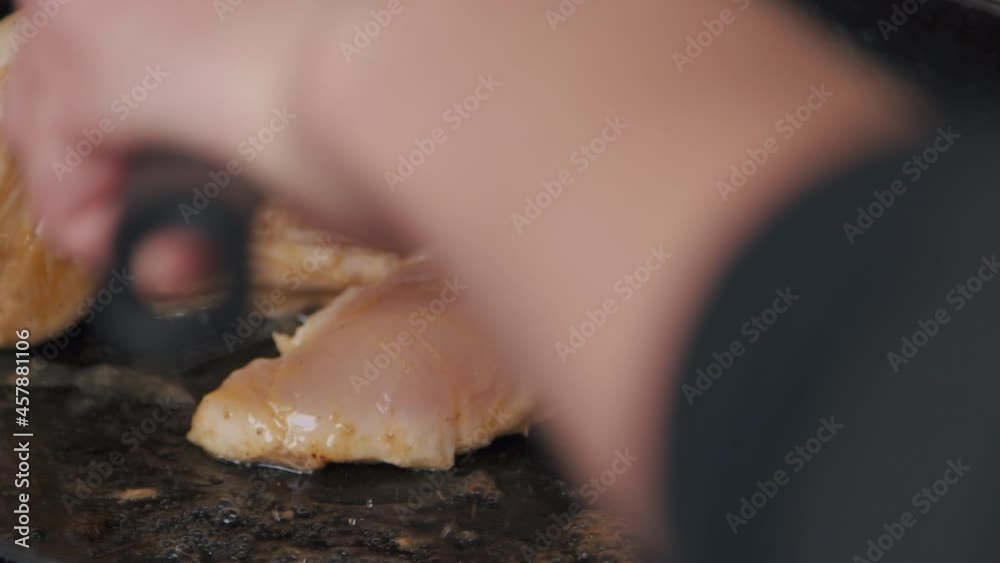 chicken fillet is fried in a pan. Cooking. Chicken meat. chicken fillet is fried in a pan. Cooking. Chicken meat.