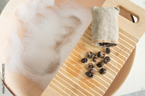 Slika na platnu Eco-friendly natural laundry detergent - soap nuts, washbowl