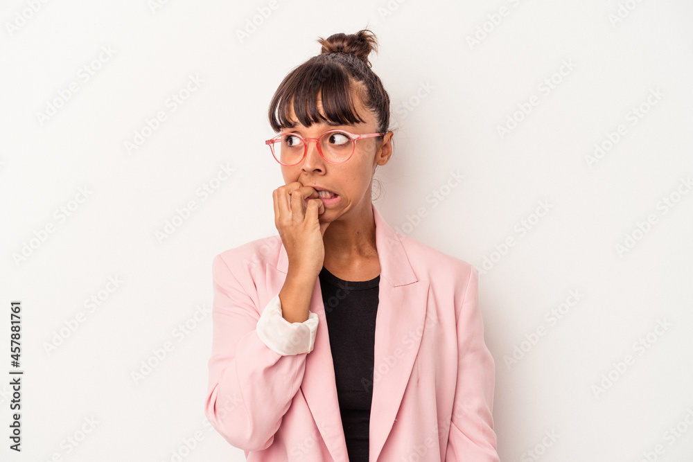 Young mixed race woman isolated on white background biting fingernails, nervous and very anxious. Young mixed race woman isolated on white background biting fingernails, nervous and very anxious.