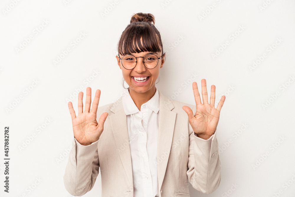 Young mixed race woman isolated on white background showing number ten with hands. Young mixed race woman isolated on white background showing number ten with hands.