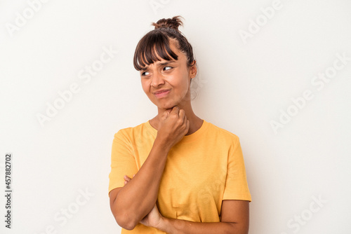 Young mixed race woman isolated on white background suffers pain in throat due a virus or infection.