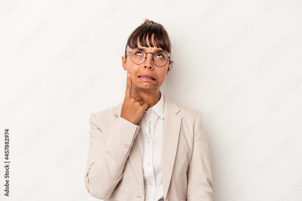 Young mixed race woman isolated on white background crying, unhappy with something, agony and confusion concept. Young mixed race woman isolated on white background crying, unhappy with something, agony and confusion concept.