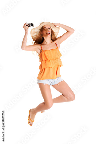 Obraz na plátne Young happy female wearing summer clothes and jumping in joy, vacation time