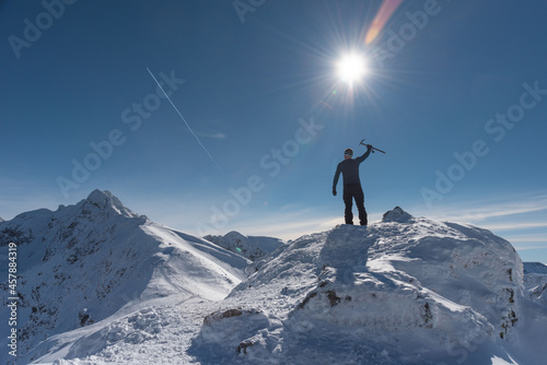 Beautiful winter views of the High Tatra Mountains with tourists, skiers and amazing states of nature 