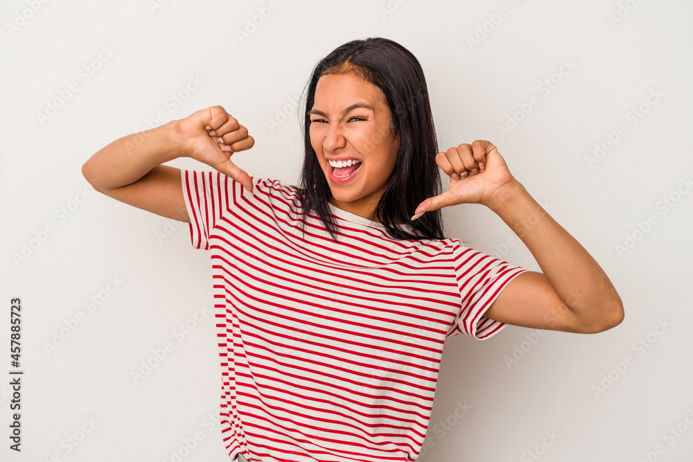 Young latin woman isolated on white background feels proud and self confident, example to follow. Young latin woman isolated on white background feels proud and self confident, example to follow.