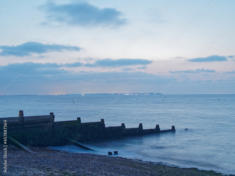 Long Exposure Whitstable Beach at Night Across from Isle of Sheppey Close Pink Sky
