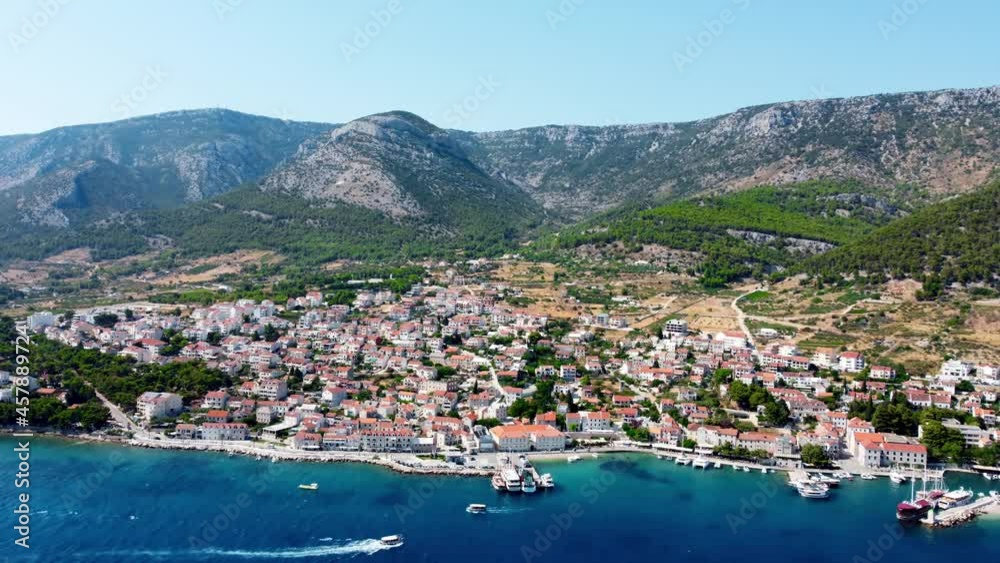 Drone shot of the island of Brac in the Adriatic Sea on the territory of Croatia. The resort center town of Bol view from the drone. Drone shot on the port of the island of Brac. Mountains of Croatia Drone shot of the island of Brac in the Adriatic Sea on the territory of Croatia. The resort center town of Bol view from the drone. Drone shot on the port of the island of Brac. Mountains of Croatia