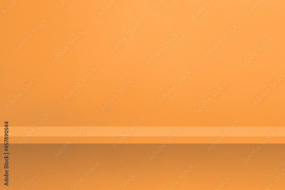 Empty shelf on light orange wall. Background template. Horizontal backdrop