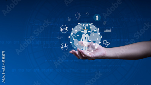 Businessman holds a world map circle and network structure HR - Human resources. The concept is Business leadership, Management, and recruitment. Social network. Different people.