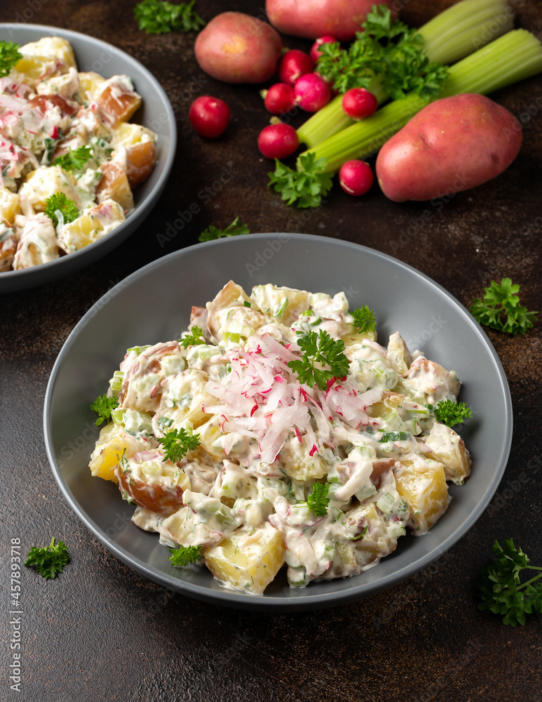 Potato salad with celery, green onion, radish, dill and eggs Potato salad with celery, green onion, radish, dill and eggs