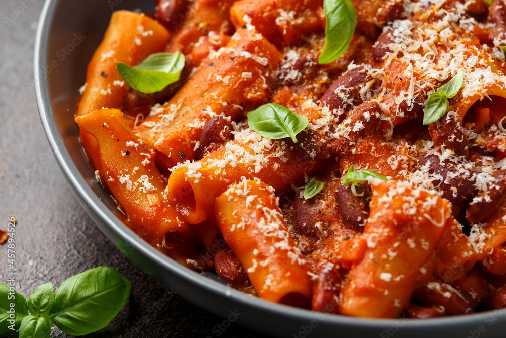 Traditional Italian Pasta e fagioli with bean, tomato and parmesan cheese Traditional Italian Pasta e fagioli with bean, tomato and parmesan cheese