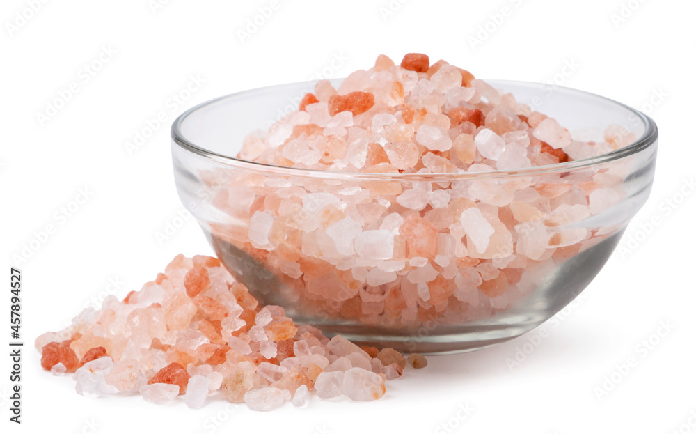 Himalayan pink salt in a transparent plate on a white background. Isolated Himalayan pink salt in a transparent plate on a white background. Isolated