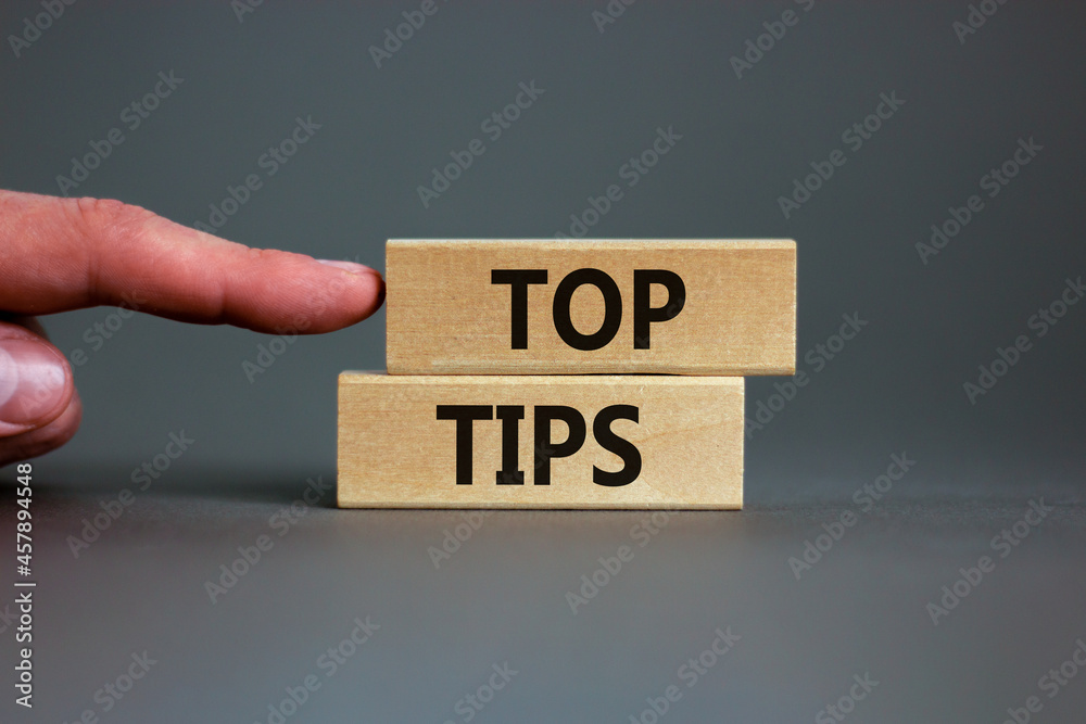 Top tips symbol. Concept words Top tips on wooden blocks on a beautiful