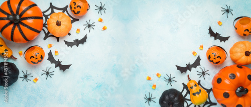 Halloween banner design with pumpkin and decorations. Greeting card or party invitation mock up. Top view with copy space