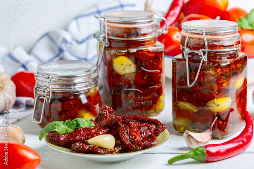 Dried tomatoes with herbs and olive oil.