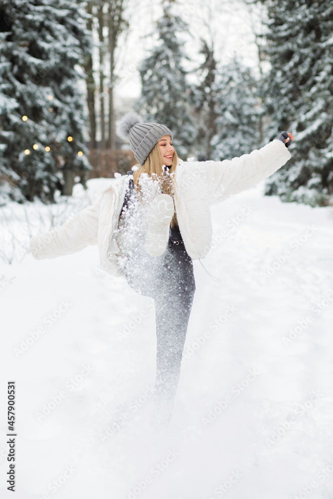 Amazing lady playing with snow in the park Amazing lady playing with snow in the park