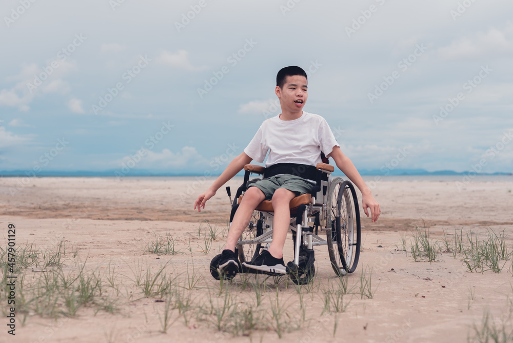 Fototapeta premium Happy handicapped teen smiling face, Sea beach background, Lifestyle happy disabled child travel , Good mental health concept