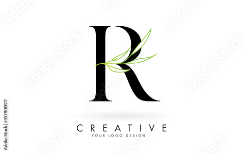 Elegant R letter logo design with long leaves branch vector illustration. Creative icon with letter E and natural elements.