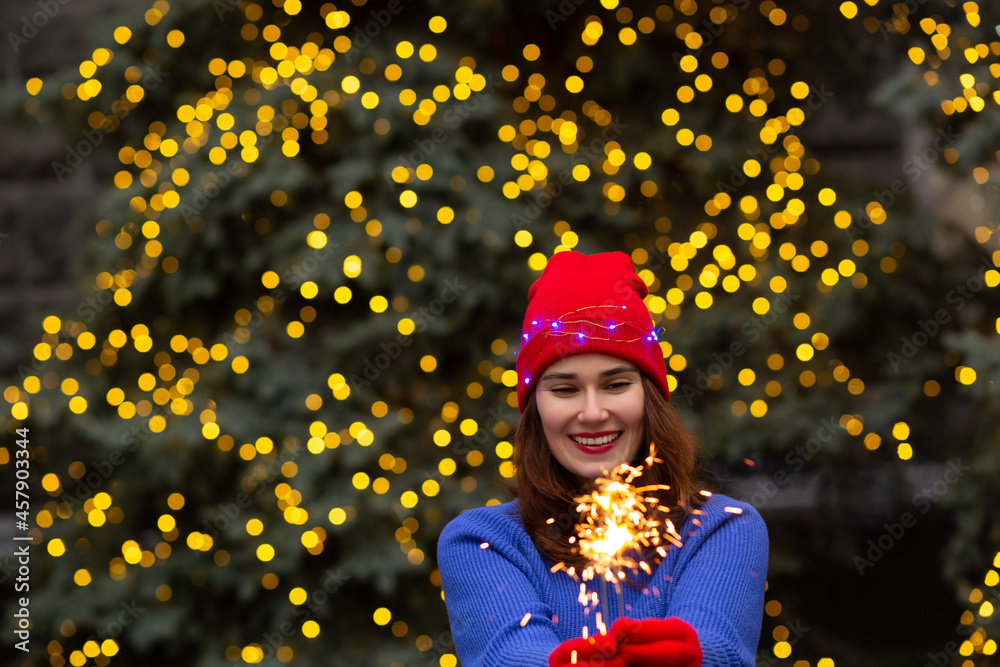 Merry lady having fun with sparklers