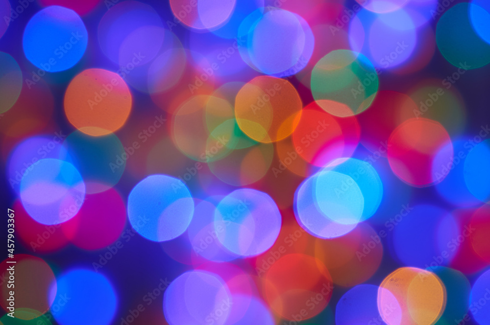  Blurred photo bokeh multicolored christmas lights .