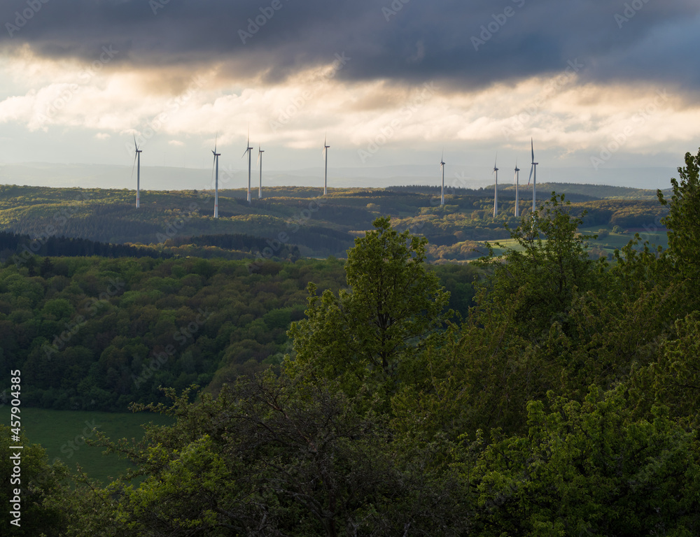 Beautiful forest landscape with windmills in saarland germany europe Beautiful forest landscape with windmills in saarland germany europe