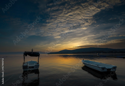 Dikili -Izmir - Turkey 15.August 2021 Boats on the sea in Bademli neighborhood at sunset