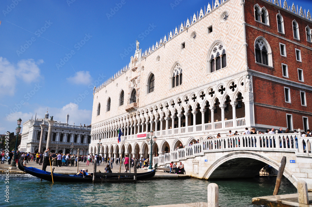 Doge's Palace. Canal view, traditional Venetian rowing boat. October 12, 2014, Venice, Italy.