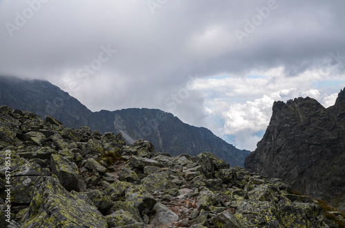 Fog and rain clouds over high mountain peaks of the ridge at High Tatras mountains, Slovakia