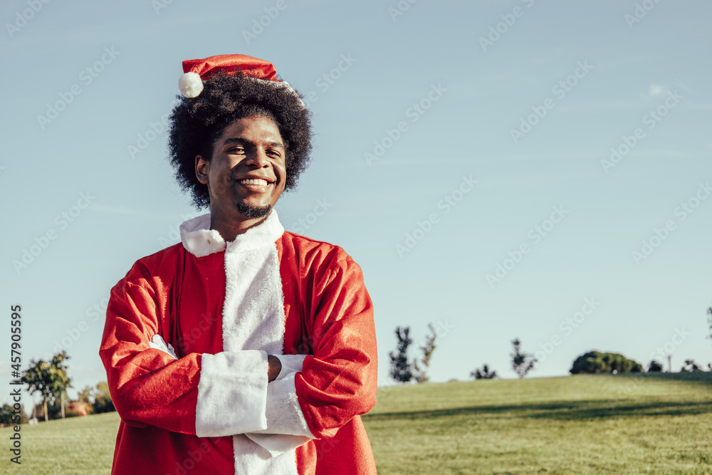 Portrait of black afro santa claus outdoors, copy space Portrait of black afro santa claus outdoors, copy space