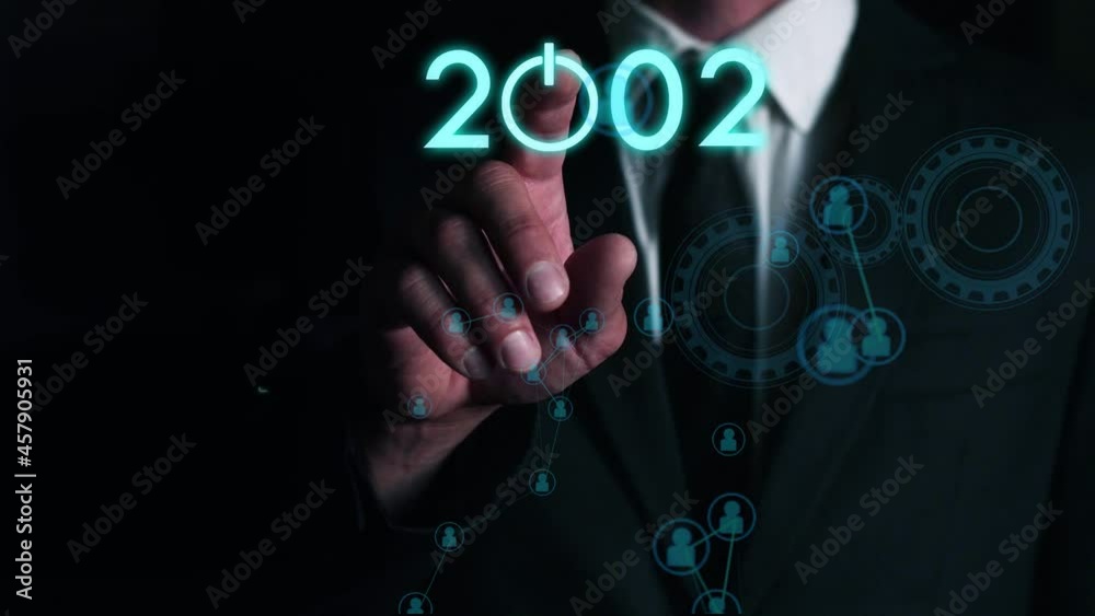 businessman presses on the virtual start button to load the date of the new year. The concept of future technologies in business development businessman presses on the virtual start button to load the date of the new year. The concept of future technologies in business development