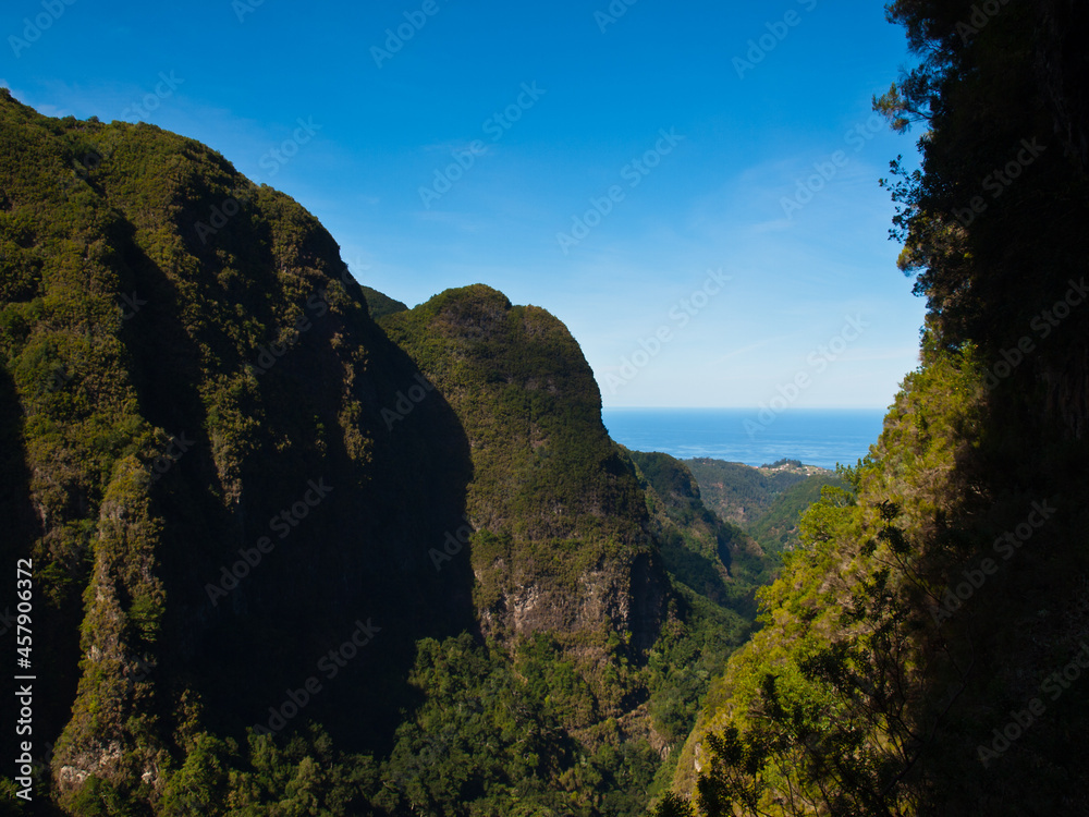 View to the sea across Madeira mountains from Levada do Caldeirão Verde path