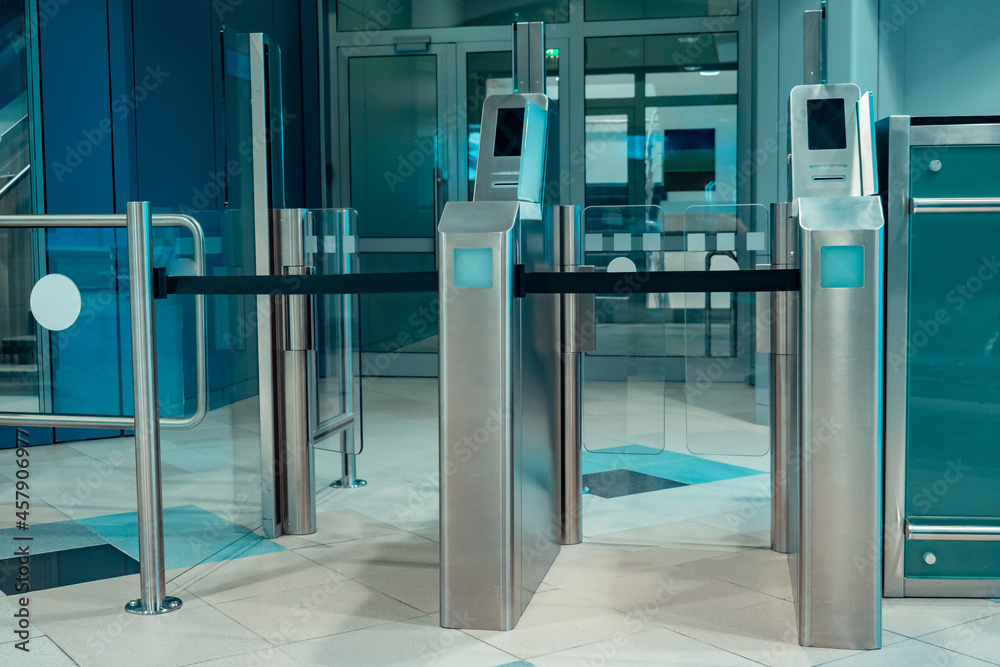 Entrance with turnstiles. The checkpoint is equipped with turnstiles. Turnstiles with glass doors. Electronic control point. Control of input and output. Throughput mode. Entrance to the metro. Entrance with turnstiles. The checkpoint is equipped with turnstiles. Turnstiles with glass doors. Electronic control point. Control of input and output. Throughput mode. Entrance to the metro.