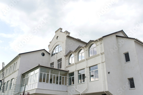 building against the backdrop of a dramatic sky with clouds