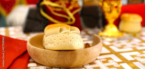 Prosphora, Prosvir, liturgical church bread used for communion during Orthodox worship, silver bowls, an icon on the throne of the Orthodox Church. The concept of Orthodoxy and faith photo