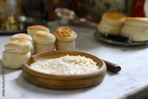 Prosphora, Prosvir, liturgical church bread used for communion during Orthodox worship, silver bowls, an icon on the throne of the Orthodox Church. The concept of Orthodoxy and faith photo