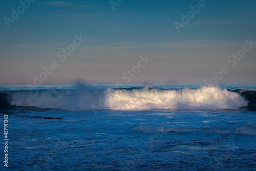 2021-09-19 WAVES CRASHING ON THE BEACH AND HIGHLIGHTED DURING SUNRISE IN LA JOLLA CALIFORNIA