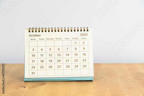 Fototapeta Naklejka Na Ścianę i Meble -  October 2022 calendar on wooden table