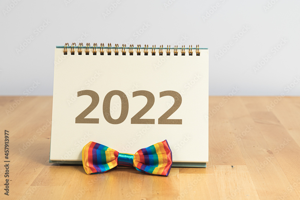 2022 calendar and rainbow bow tie - symbol of LGBT society 2022 calendar and rainbow bow tie - symbol of LGBT society