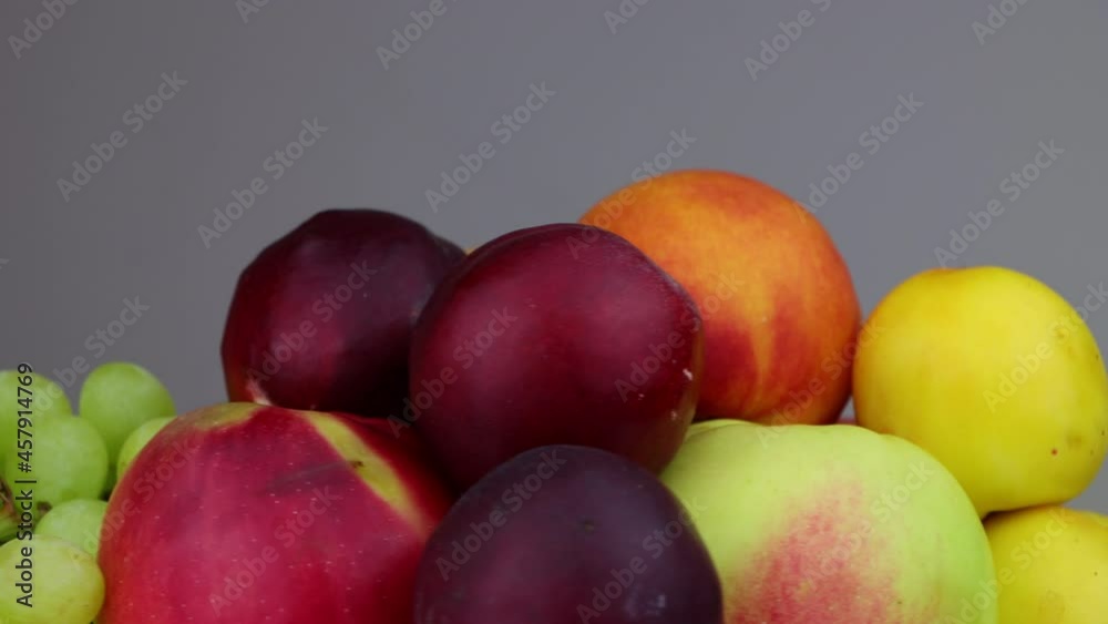 Fresh fruits - apples, peaches, plums, grapes. Healthy food concept. Fresh fruits - apples, peaches, plums, grapes. Healthy food concept.