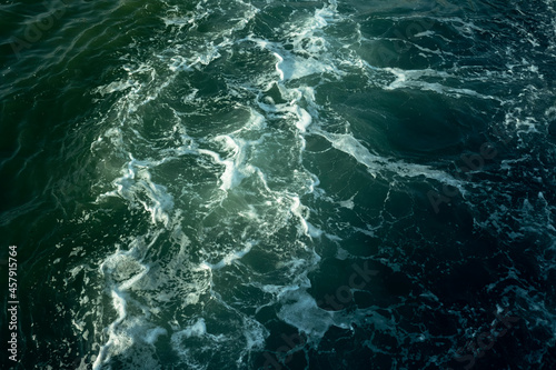 Fototapeta Naklejka Na Ścianę i Meble -  The texture of the surface of blue Sea water.