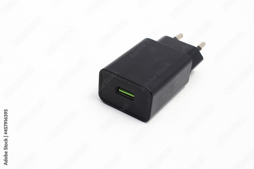 Black Cell Phone Charger Adapter with a green micro USB quick charge on hand isolated on white background Black Cell Phone Charger Adapter with a green micro USB quick charge on hand isolated on white background